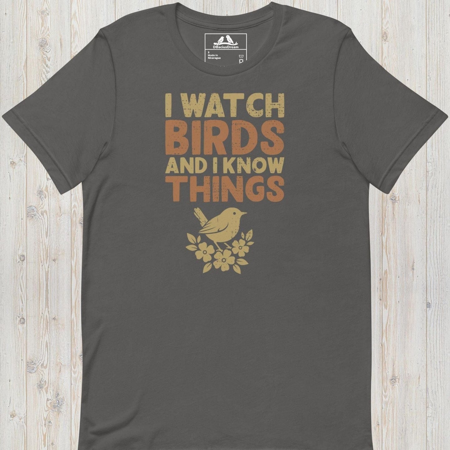 Gray I watch birds and I know things t-shirt with a bird graphic and floral elements
