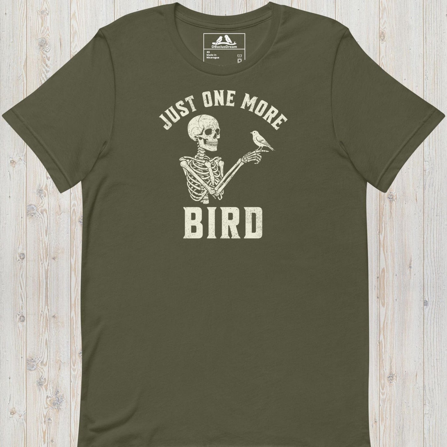 Olive green just one more bird t-shirt with a skeleton birder graphic and the quote "Just One More Bird"