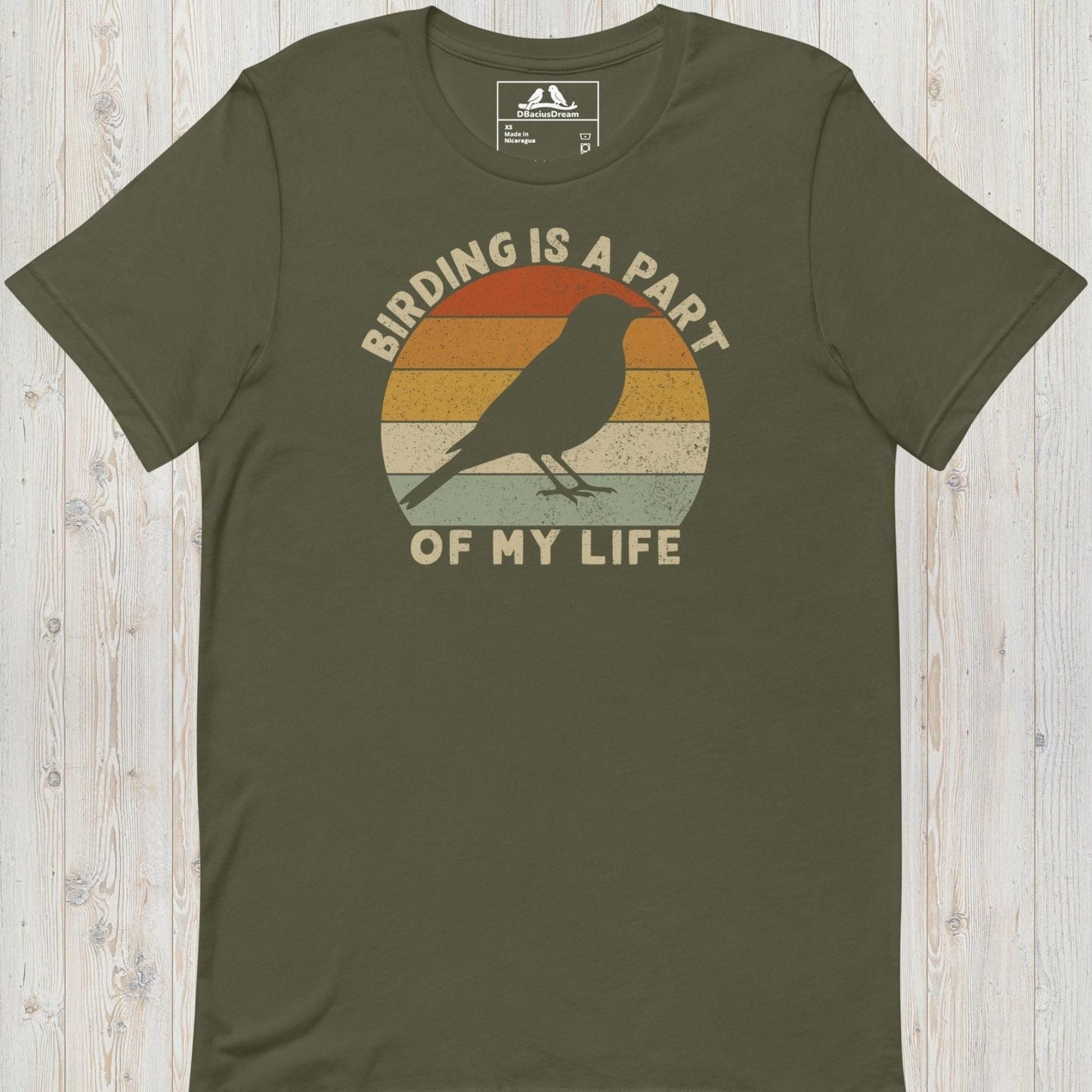 Olive green bird lover t-shirt with a vintage sunset graphic, bird silhouette and the quote "Birding Is A Part Of My Life"