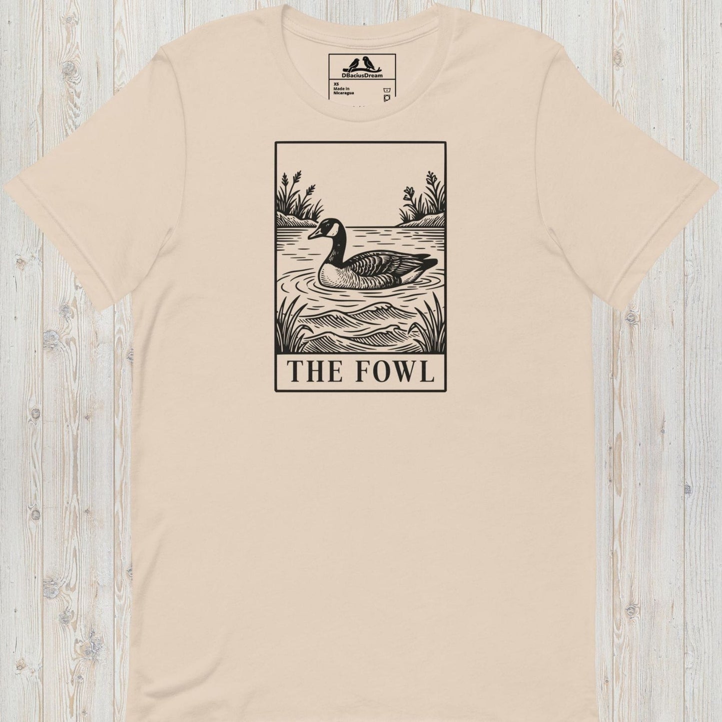 Light beige funny goose t-shirt with a black graphic of a goose and the text ”The Fowl”