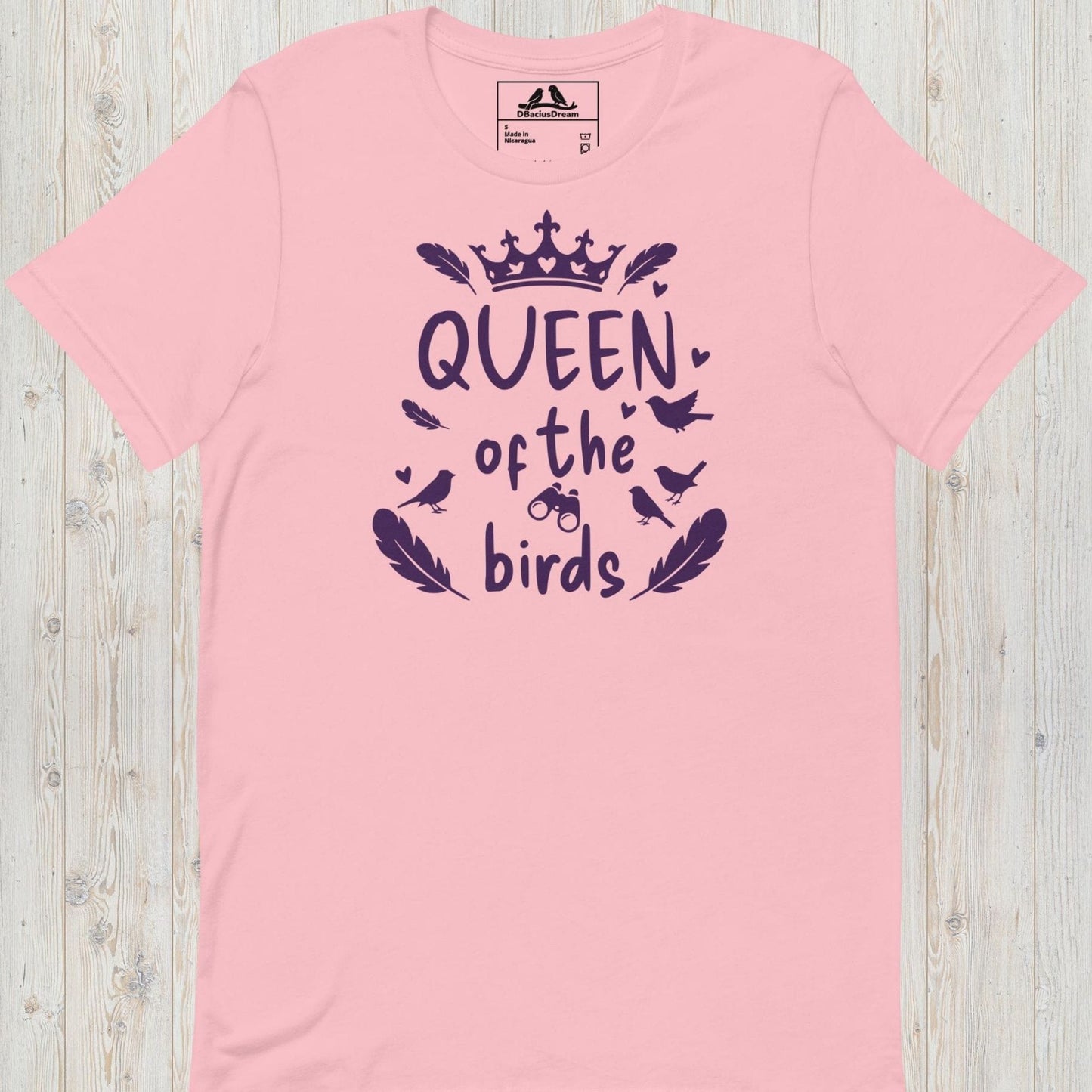 Pink queen of the birds t-shirt with a purple bird graphic, crown design and decorative bird silhouettes