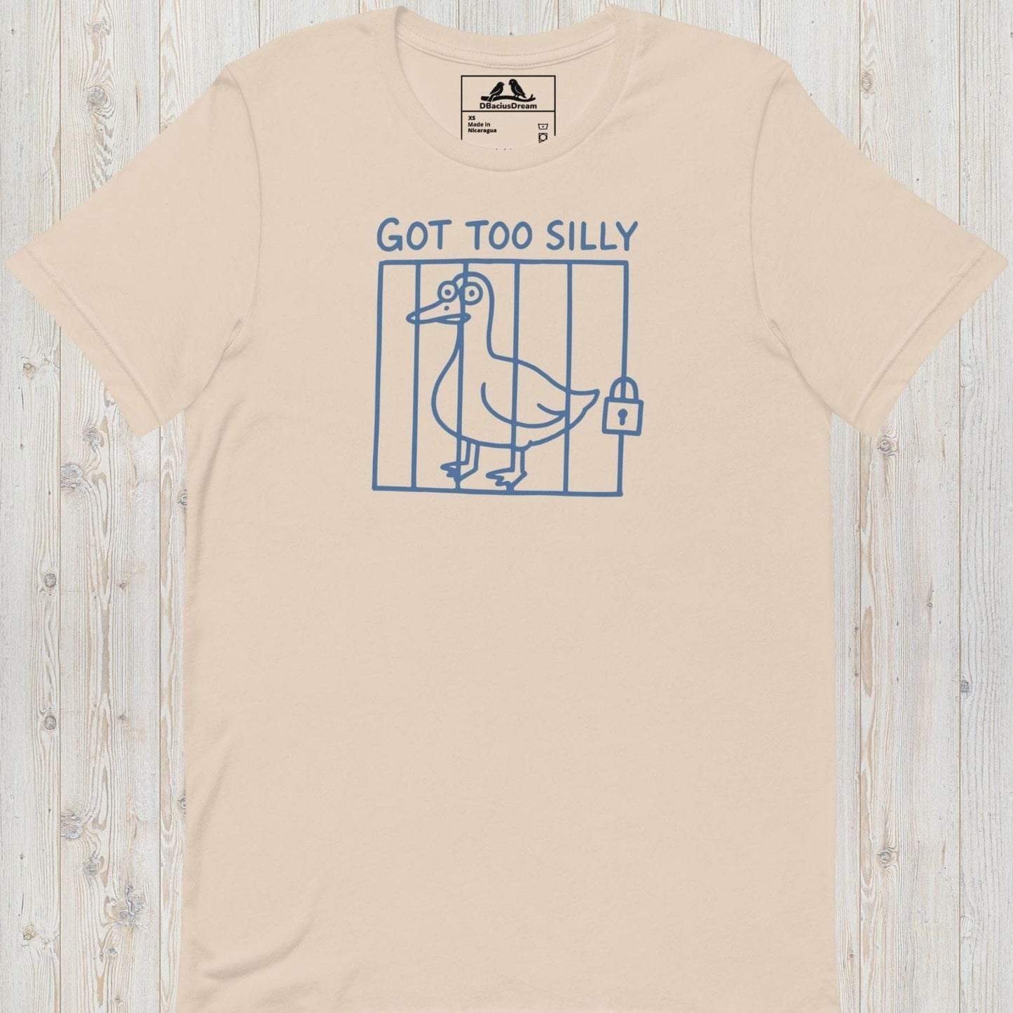 Light beige got too silly funny goose t-shirt with a minimalist goose illustration behind bars and the quote "Got Too Silly"