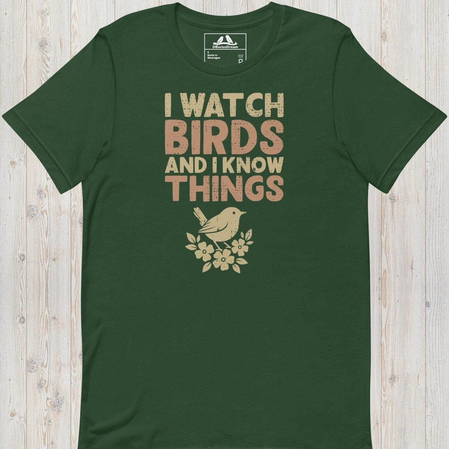 Green I watch birds and I know things t-shirt with a bird graphic and floral elements
